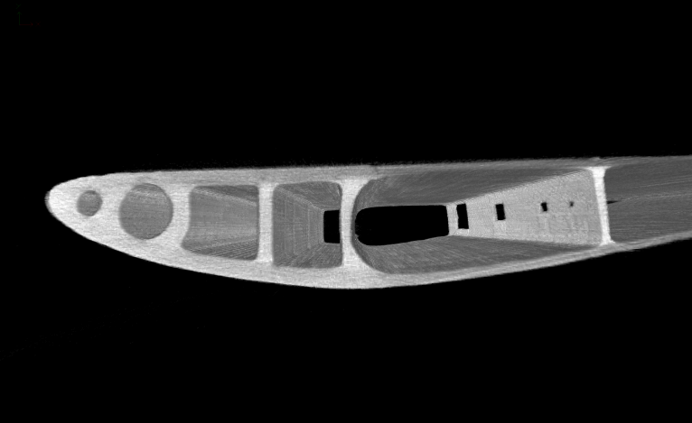 Рис.2. Пример raycast визуализации реконструированного изображения пластикового крыла со специально сделанными отверстиями на внутренних стенках. 