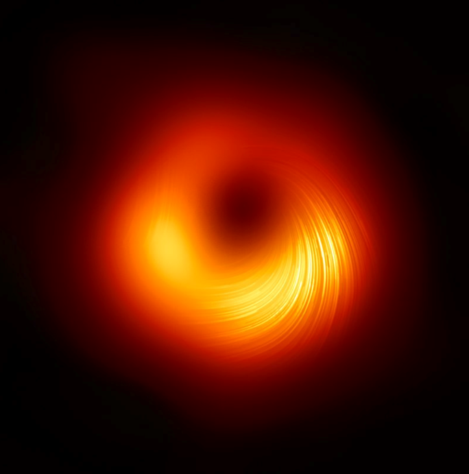 Сверхмассивная чёрная дыра в центре галактики М87. Это первое в истории изображение чёрной дыры получено в 2019 году 