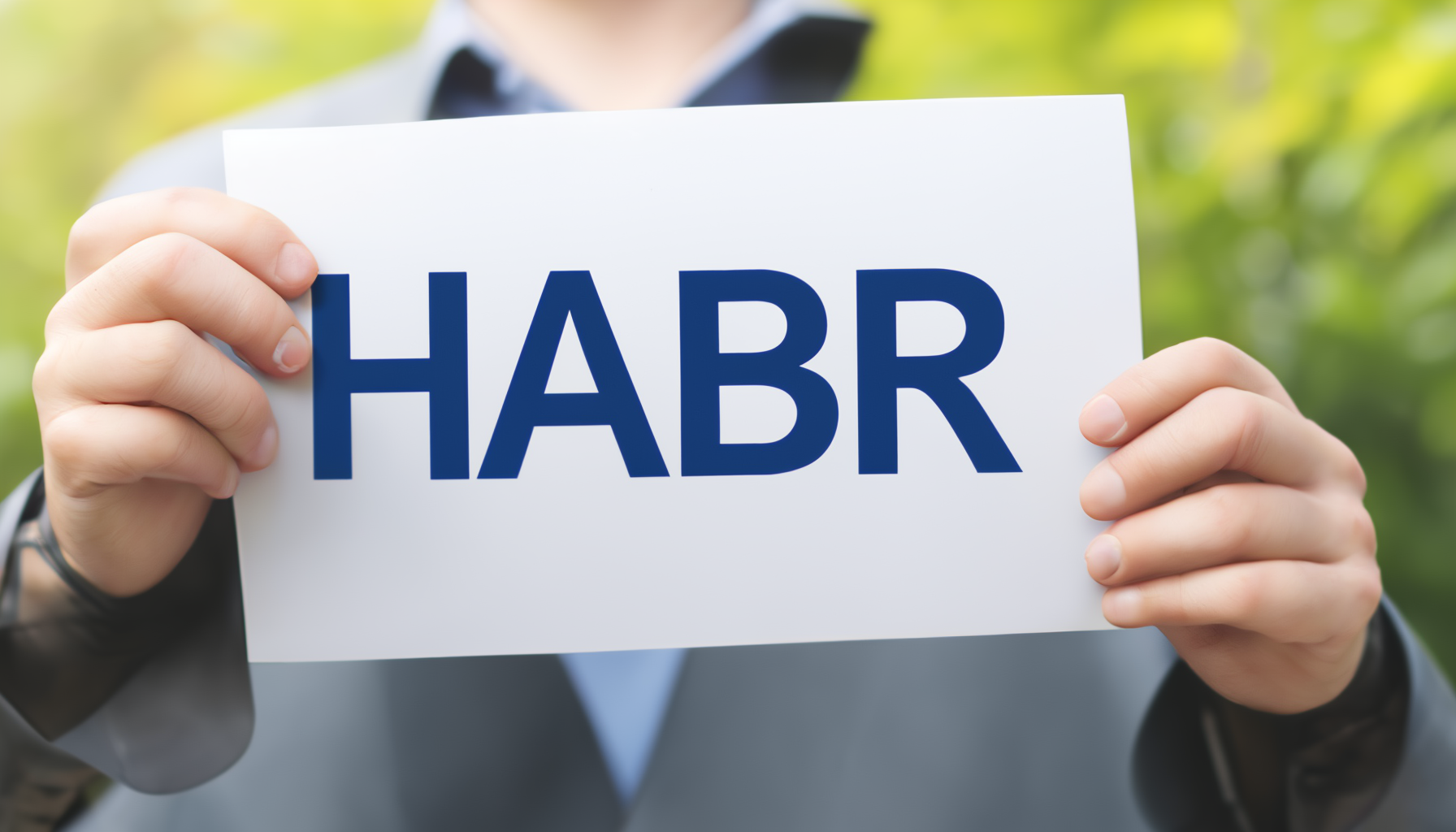 An image of a sign in the hands of a man with "Habr" written on it