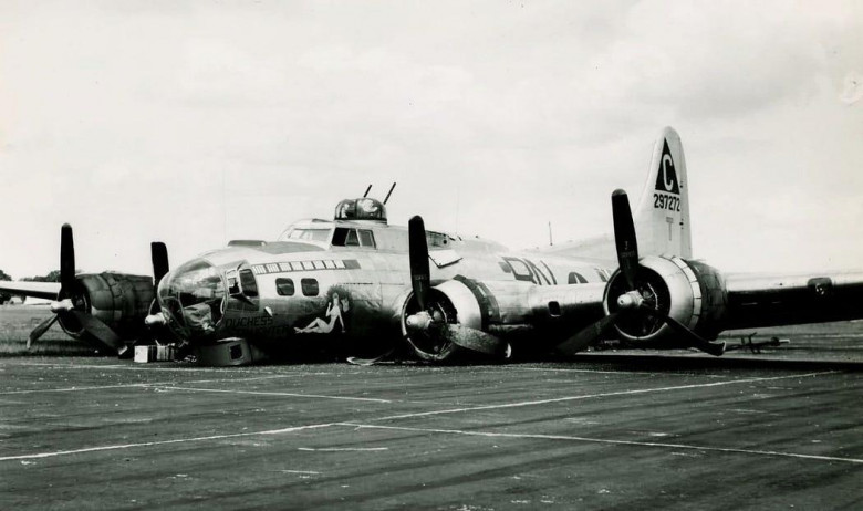 Crashed B-17 on runway.